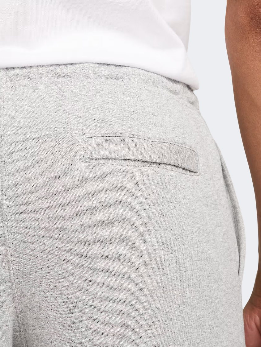 بنطال نمط حياة رجالي Nike Club French Terry مفتوح الحافة رمادي هيذر/أبيض