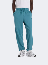 بنطال نمط حياة رجالي من نيو بالانس أثلتيكس من قماش الفليس الفرنسي بلون تيال الكبير